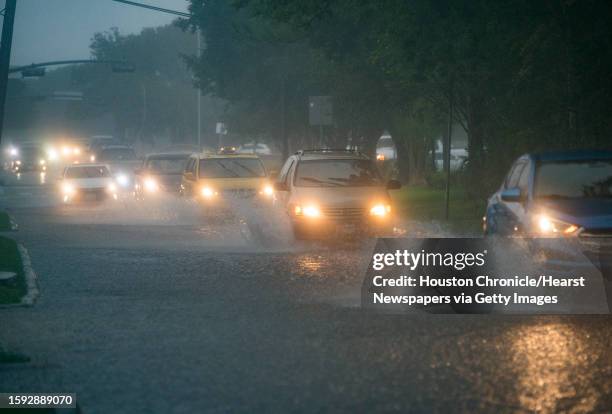 Cars splash through heavy water filling Chimney Rock south of Brays Bayou in Houston, Tuesday, Sept. 17, 2019. A tropical depression in the Gulf of...