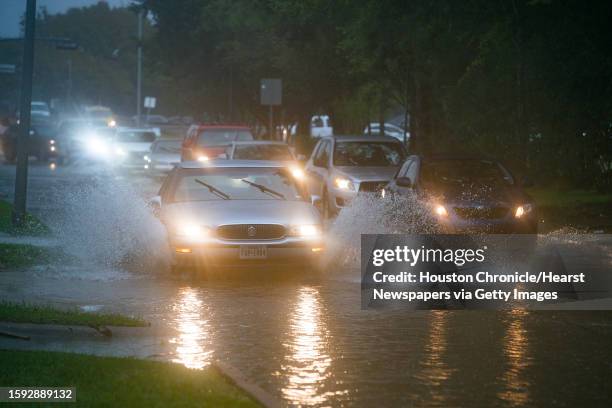Cars splash through heavy water filling Chimney Rock south of Brays Bayou in Houston, Tuesday, Sept. 17, 2019. A tropical depression in the Gulf of...