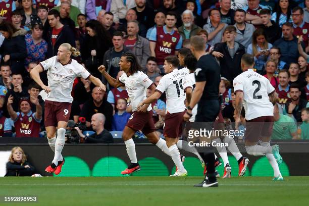 Erling Haaland of Manchester City celebrates scoring the opening goal during the Premier League match between Burnley FC and Manchester City at Turf...