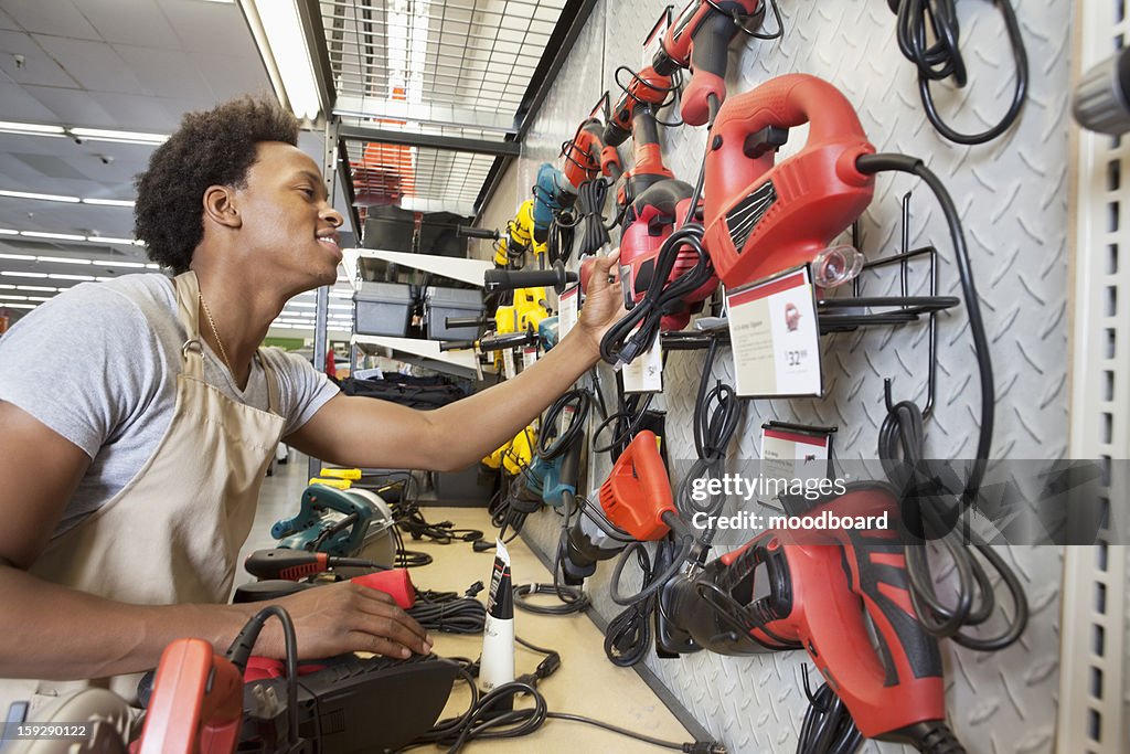 African American man working in an electronics store