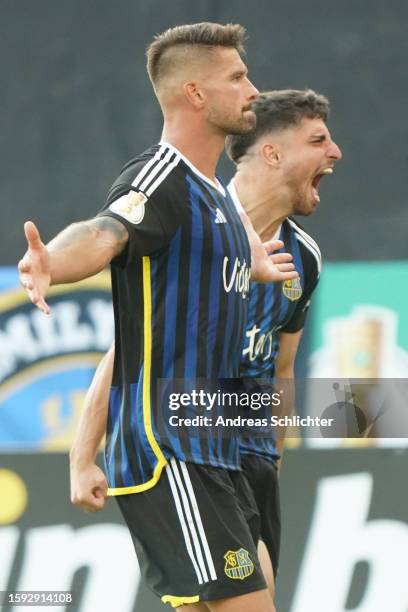 Kai Bruenker and Fabio Di Michele Sanchez of 1. FC Saarbruecken celebrate during the DFB cup first round match between 1. FC Saarbrücken and...