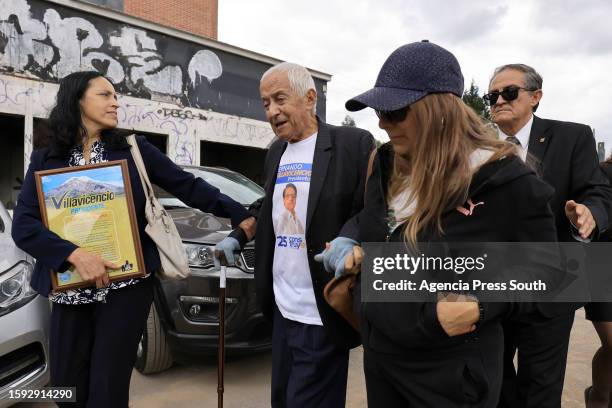 Alcibiades Villavicencio, father of late presidential candidate Fernando Villavicencio, walks out of th funeral home after the wake on August 11,...