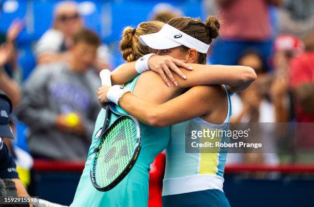 Belinda Bencic of Switzerland and Petra Kvitova of the Czech Republic embrace at the net after the third round on Day 5 of the National Bank Open...