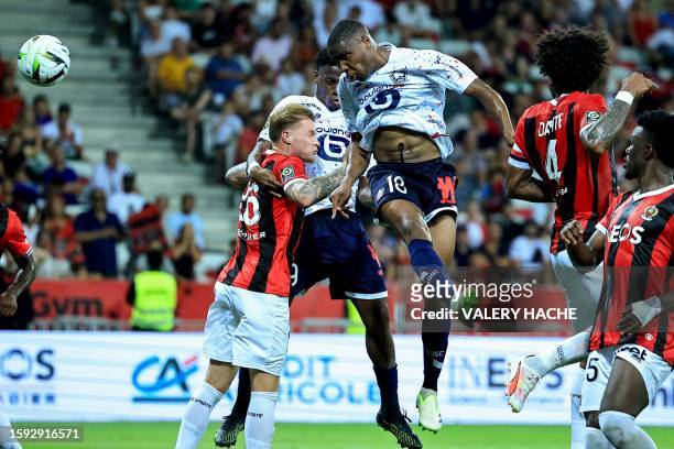 Lille's French defender Bafode Diakite heads the ball to score his team's first goal during the French L1 football match between Nice and LOSC Lille...