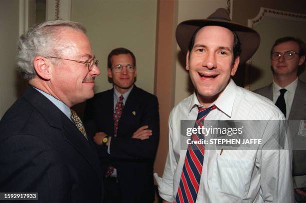 Cyber-journaIist Matt Drudge talks to Congressman Bob Barr, R-GA, on Capitol Hill 08 October 1998 after the US House of Representatives voted to...