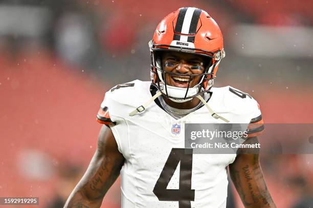 Deshaun Watson of the Cleveland Browns laughs prior to a preseason game against the Washington Commanders at Cleveland Browns Stadium on August 11,...