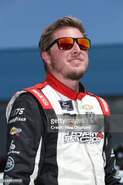 Garrett Smithley, driver of the Buck's Oil Chevrolet, waits on the grid during practice for the NASCAR Xfinity Series Cabo Wabo 250 at Michigan...