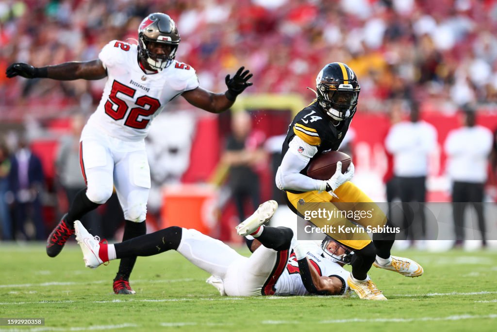 George Pickens of the Pittsburgh Steelers breaks a tackle by Nolan News  Photo - Getty Images