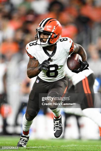 Elijah Moore of the Cleveland Browns carries the ball during the first half of a preseason game against the Washington Commanders at Cleveland Browns...