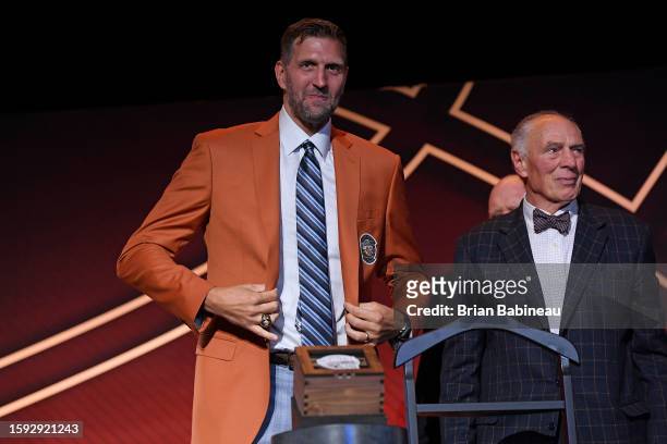 Dirk Nowitzki receives his jacket from Holger Geschwindner during the Class of 2023 Tip-Off Celebration and Awards Gala as part of the 2023...