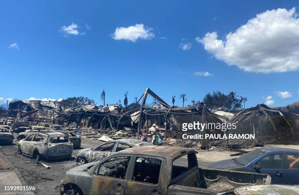 Burned cars, destroyed buildings and homes are pictured in the aftermath of a wildfire in Lahaina, western Maui, Hawaii on August 11, 2023. A...