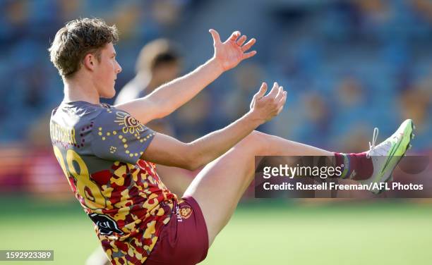 Jaspa Fletcher of the Lions warms up during the 2023 AFL Round 22 match between the Brisbane Lions and the Adelaide Crows at The Gabba on August 12,...