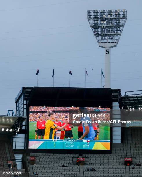 The Matildas FIFA Women's World Cup quarter final match against France is shown on the big screens before the 2023 AFL Round 22 match between the...