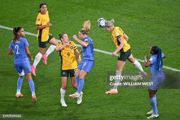 Australia's defender Alanna Kennedy heads the ball during the Australia and New Zealand 2023 Women's World Cup quarter-final football match between...