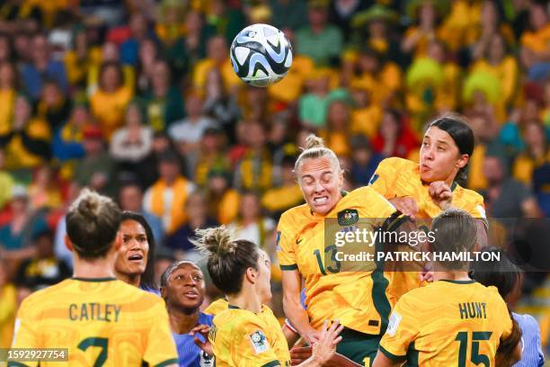 Australia's midfielder Tameka Yallop and Australia's forward Sam Kerr attempt a header during the Australia and New Zealand 2023 Women's World Cup...