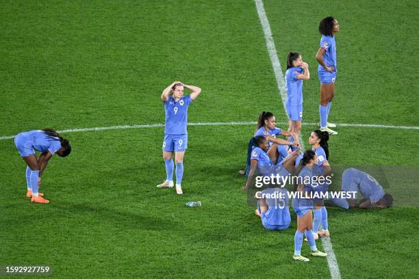 France's players react during a penalty shoot-out during the Australia and New Zealand 2023 Women's World Cup quarter-final football match between...