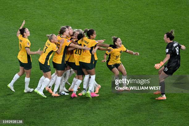 Australia's players celebrate their victory after a penalty shoot-out during the Australia and New Zealand 2023 Women's World Cup quarter-final...