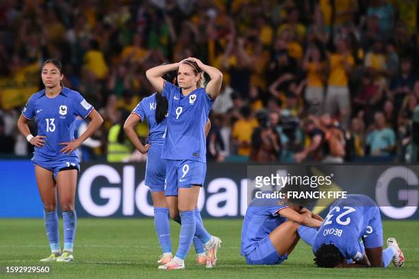France's forward Eugenie Le Sommer and teammates react at the end of the Australia and New Zealand 2023 Women's World Cup quarter-final football...