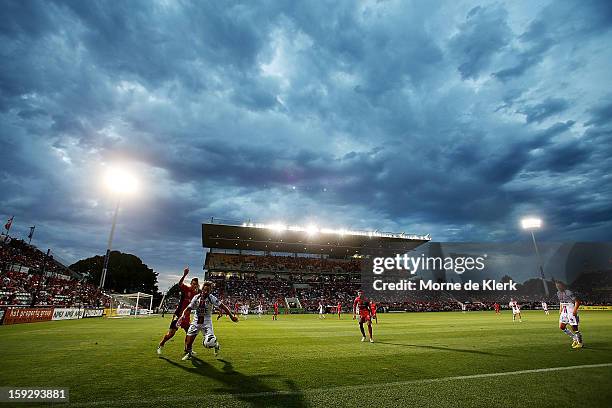 Nick Ward of Perth holds off Daniel Bowles of Adelaide during the round 16 A-League match between Adelaide United and the Perth Glory at Hindmarsh...