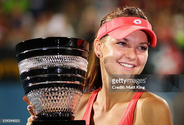 Agnieszka Radwanska of Poland poses with the champions trophy after winning the women's final match against Dominika Cibulkova of Slovaki during day...