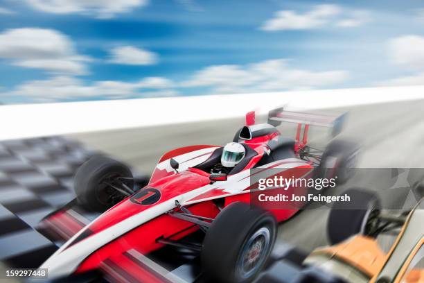 indy race car driver crossing finish line. - crossing the finishing line stock pictures, royalty-free photos & images