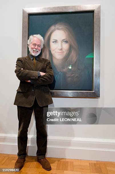 British artist Paul Emsley poses in front of his portrait of Catherine, The Duchess of Cambridge after its unveiling at the National Portrait Gallery...