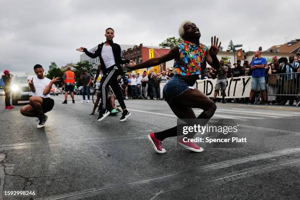 People gather at a memorial for O’Shae Sibley on August 04, 2023 in New York City. The memorial was held at the gas station where he was murdered...