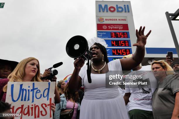 People gather at a memorial for O’Shae Sibley on August 04, 2023 in New York City. The memorial was held at the gas station where he was murdered...