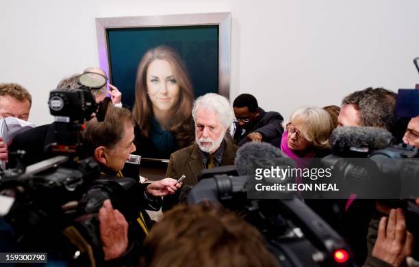 British artist Paul Emsley poses in front of his portrait of Catherine, The Duchess of Cambridge after its unveiling at the National Portrait Gallery...