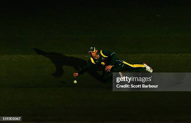 Phillip Hughes of Australia dives to stop the ball during game one of the Commonwealth Bank One Day International series between Australia and Sri...