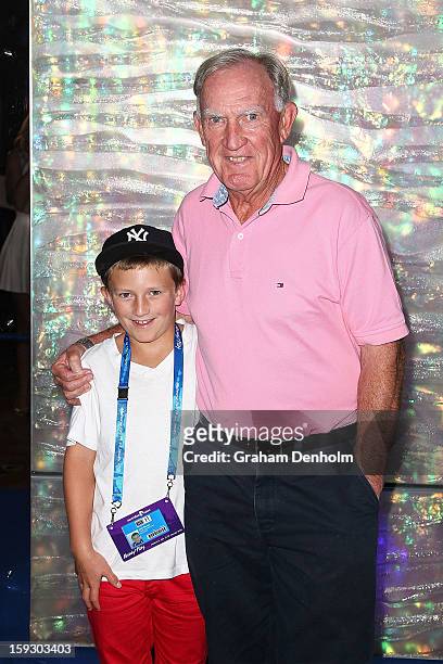 Tony Roche and his grandson arrive at the official Australian Open player party at the Grand Hyatt on January 11, 2013 in Melbourne, Australia.