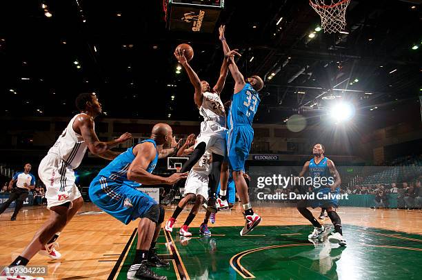 Demonte Harper of the Erie BayHawks drives the paint into Melvin Ely of the Texas Legends during the 2013 NBA D-League Showcase on January 10, 2013...