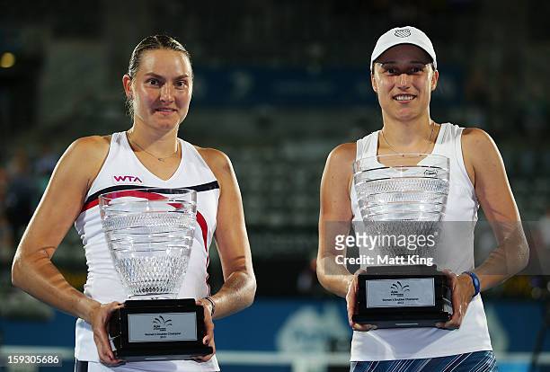 Katarina Srebotnik of Slovalka and Nadia Petrova of Russia pose with the champions trohies after winning the women's doubles final match against Sara...