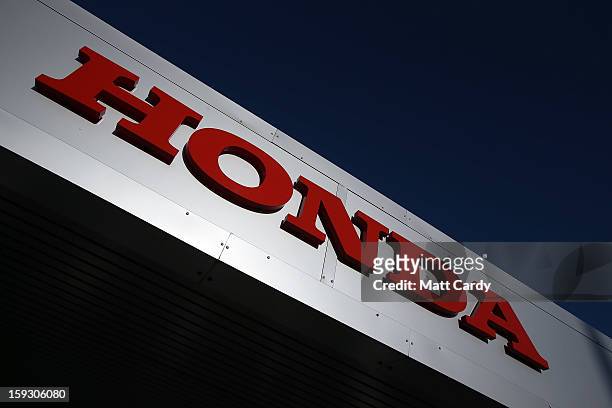 The Honda logo is seen on the outside of a building at the Honda car assembly plant following the announcement that the firm is to axe 800 jobs on...