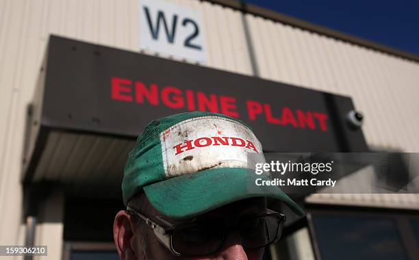 Phil Beckett speaks to waiting media as he leaves his shift at the Honda car assembly plant following the announcement that the firm is to axe 800...
