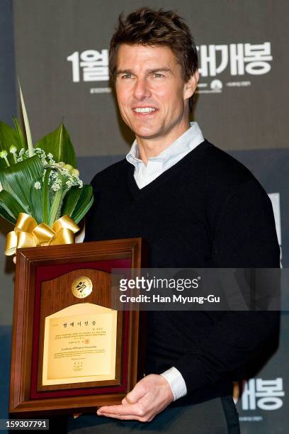 Actor Tom Cruise poses for media after receive an certificate honorary citizenship of the Busan City by Busan City mayor, Huh Nam-Shik during the...