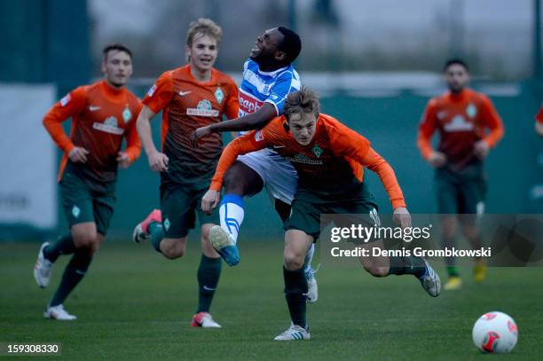 Felix Kroos of Bremen and Ricardo Talu of Zwolle battle for the ball during a friendly match between Werder Bremen and PEC Zwolle on January 11, 2013...