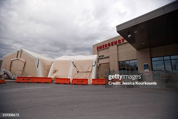 Mobile tents set up to handle the recent influx of flu cases stand outside the Lehigh Valley Health Network's main hospital campus January 11, 2013...