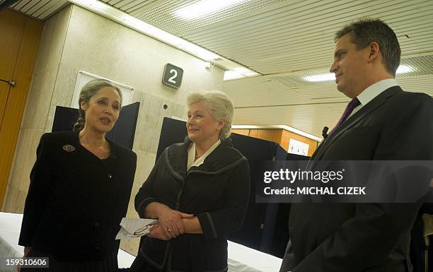 Presidential candidate Tatana Fischerova talks with other presidential candidates Zuzana Roithova and Jiri Dientsbier prior to the pre-election's TV...