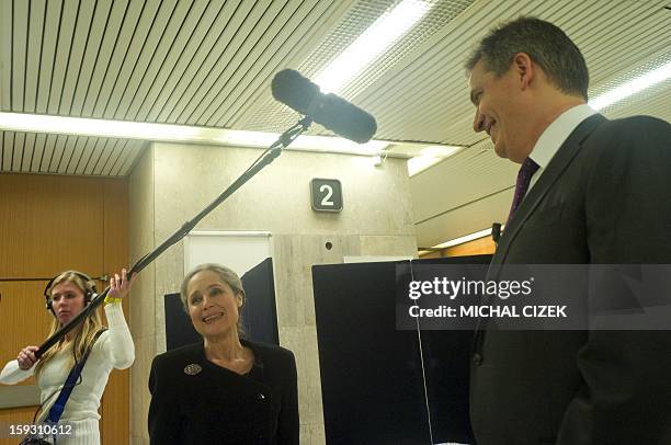 Presidential candidate Tatana Fischerova talks with other presidential candidate Jiri Dientsbier prior to the pre-election's TV debate on January 10,...
