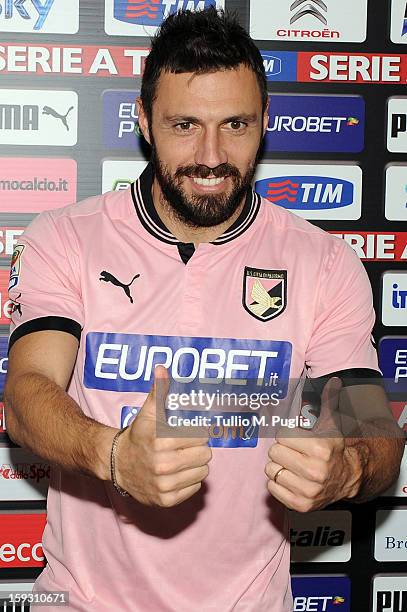 Andrea Dossena of Palermo poses wearing his new team shirt during his presentation as new player of US Citta di Palermo at Tenente Carmelo Onorato...