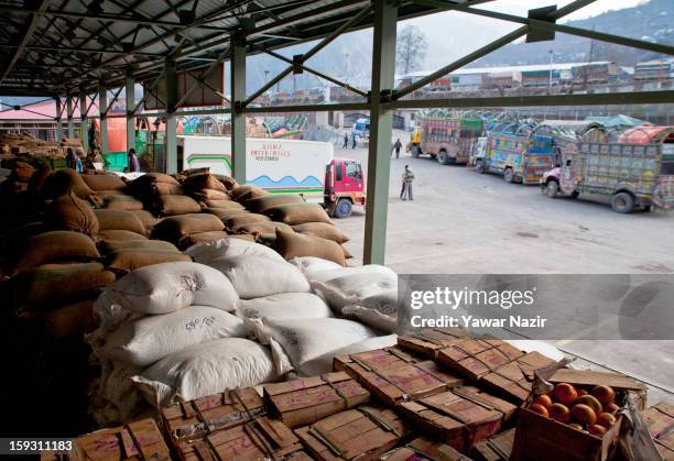 Goods unloaded from Pakistani vehicles sit at the trade facilitation centre in the border area near Uri on January 11, 2013 in Salamabad, 120 km...