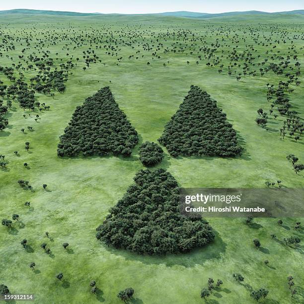forest shaped radioactivity symbol - radiation symbol stock pictures, royalty-free photos & images