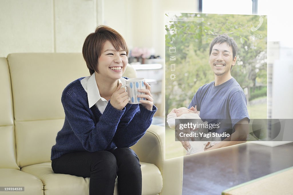 Woman using Futuristic monitor