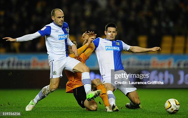 Kevin Doyle of Wolverhapton Wanderers battles with Scott Dann and Danny Murphy of Blackburn Rovers during the npower Championship match between...