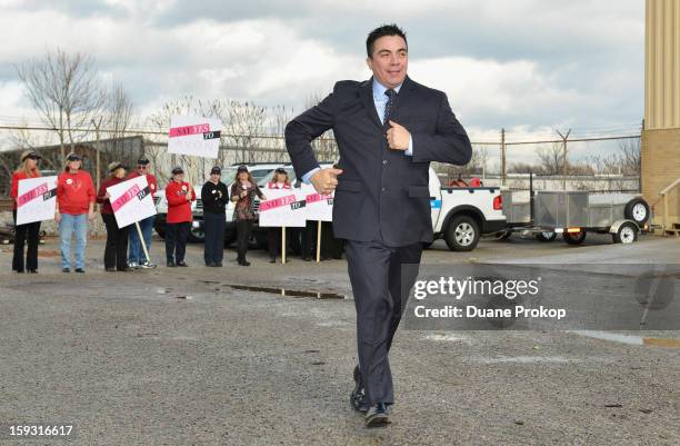 Mike Sanchez runs across the parking lot as Avon Kicks off the SAY YES TO AVON BEAUTY on January 11, 2013 in Columbus, Ohio.