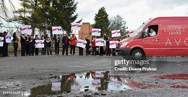 Representatives cheer as vans roll out as Avon Kicks off the SAY YES TO AVON BEAUTY on January 11, 2013 in Columbus, Ohio.