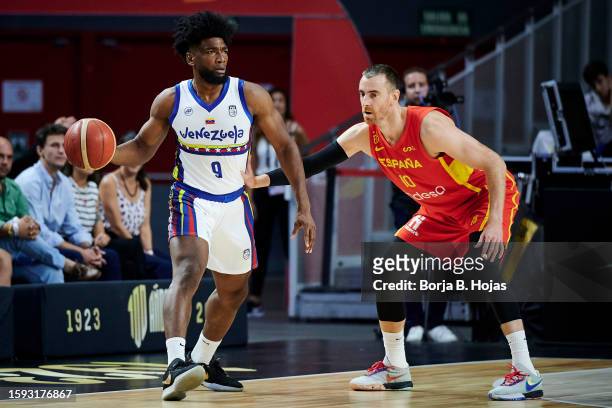 Victor Claver of Spain and Pedro Chourio of Venezuela during preparation match between Spain and Venezuela to World Cup 2023 at WiZink Center on...