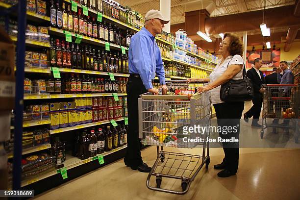 Florida Governor Rick Scott speaks with Maria Socorro as he visits Sedano’s Supermarket on January 11, 2013 in Miami, Florida. Governor Scott spent...