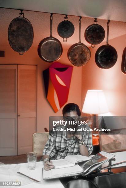 Actress and TV personality Allegra Curtis does her homework in the kitchen at home in January 1982 in Los Angeles, California.